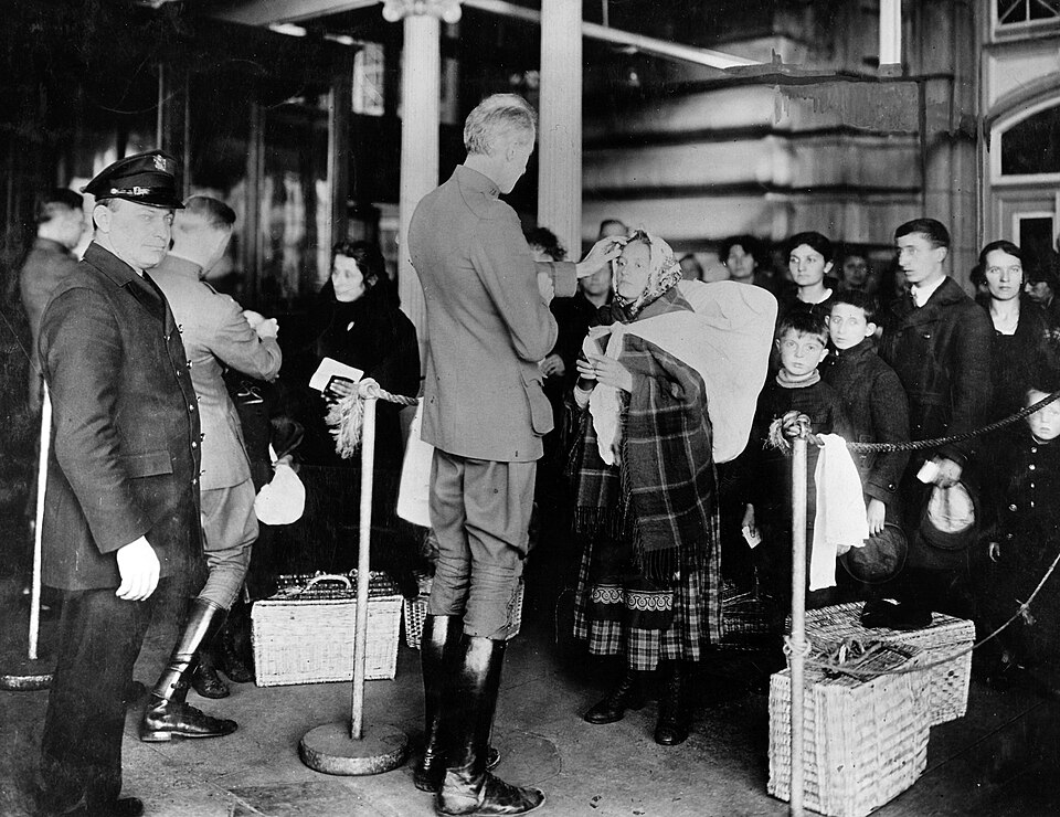 Public Health Service physicians checking immigrants arriving to the United States for signs of illness.